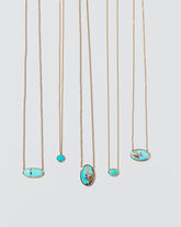 Group of Turquoise Necklaces on light colored background.