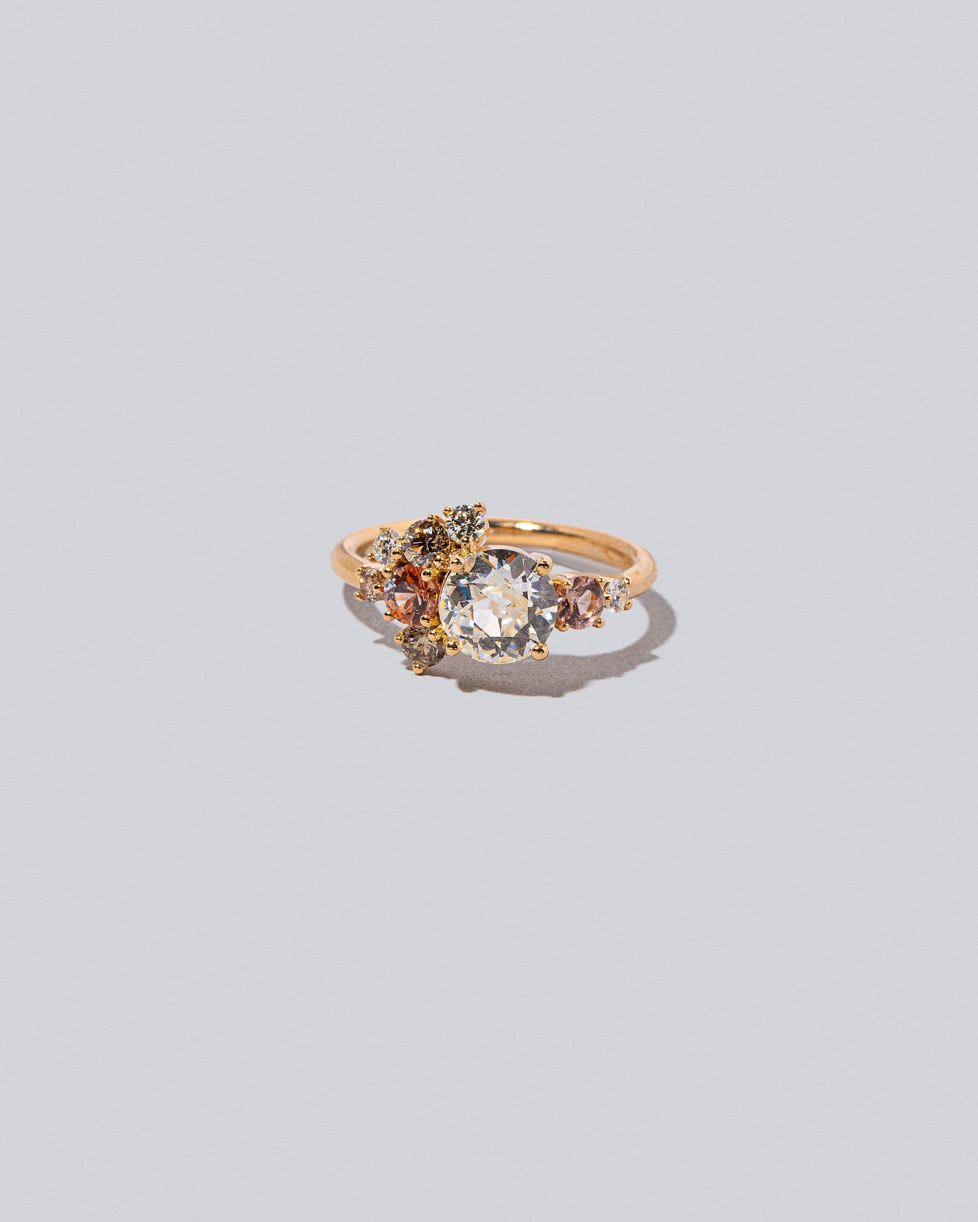 Product photo of the Peach Vega Ring on a light color background. 