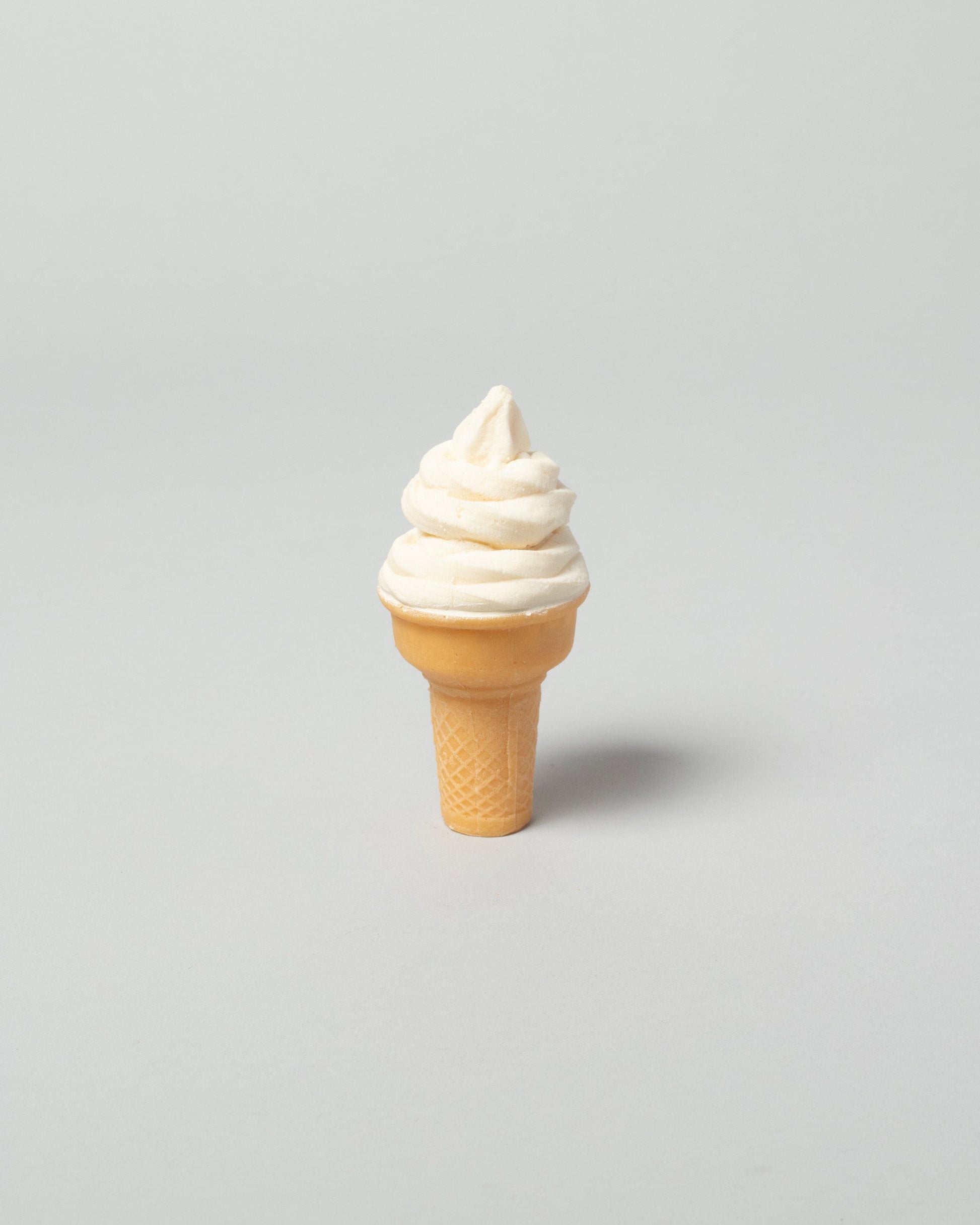 Spills Vanilla Cone Ice Cream on light color background.