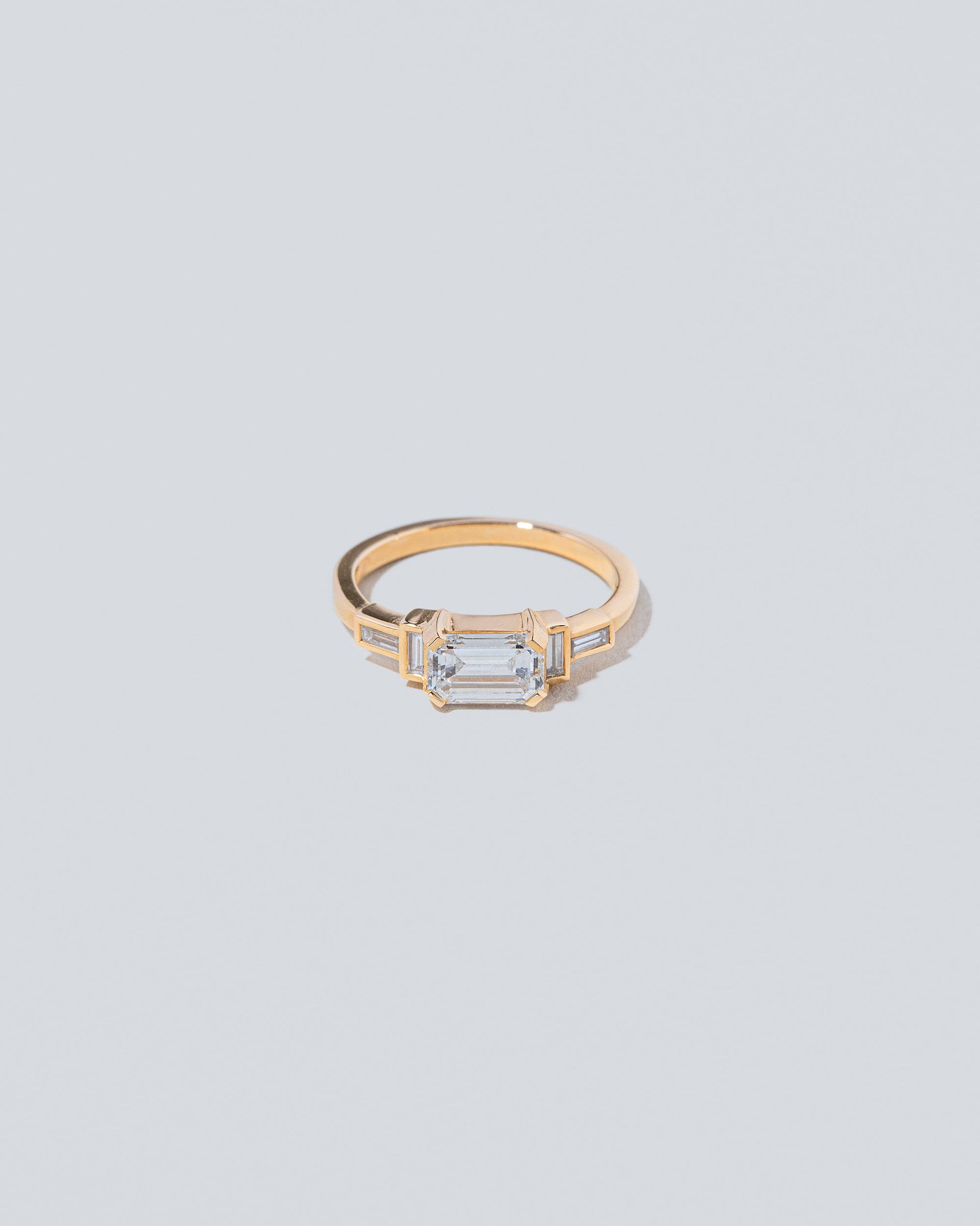 Gold Expression Ring on light color background.