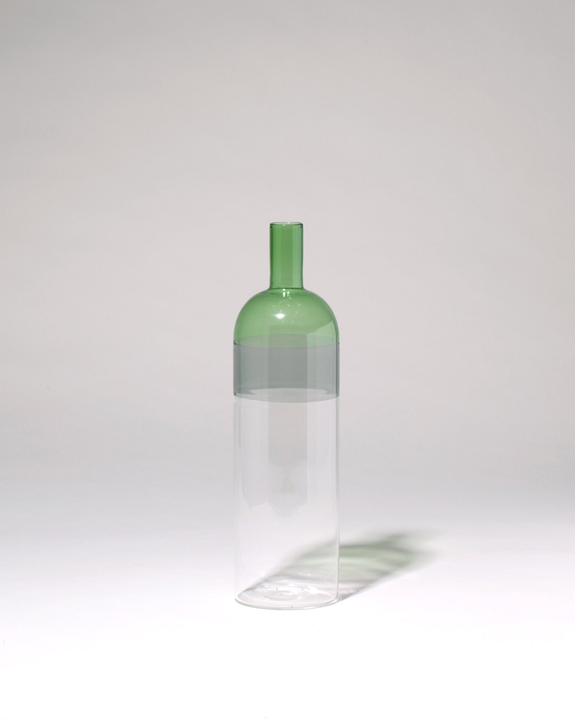 Ichendorf Milano Clear/Smoke/Green Tequila Sunrise Bottle on light color background.