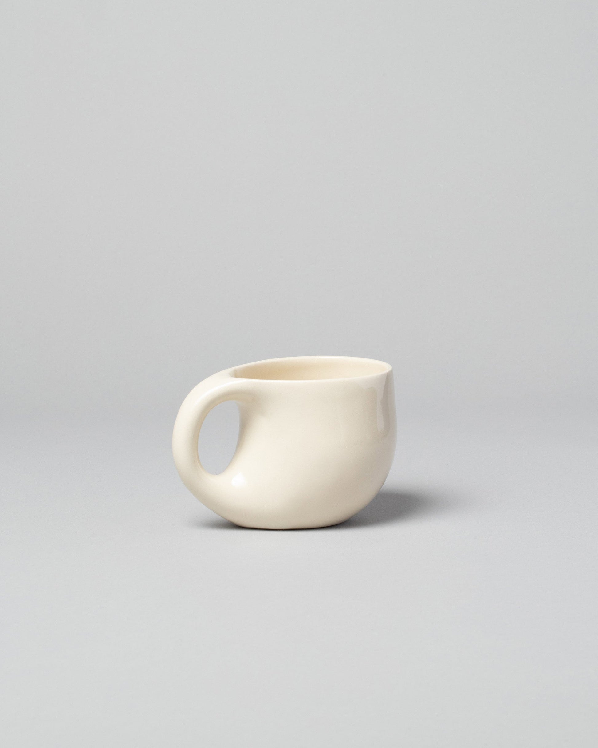 Dust and Form Large Cream Comfort Mug on light color background.