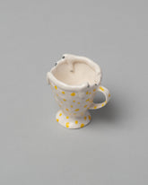 Closeup detail of the Eleonor Boström Mini Spotty Espresso Cup on light color background.