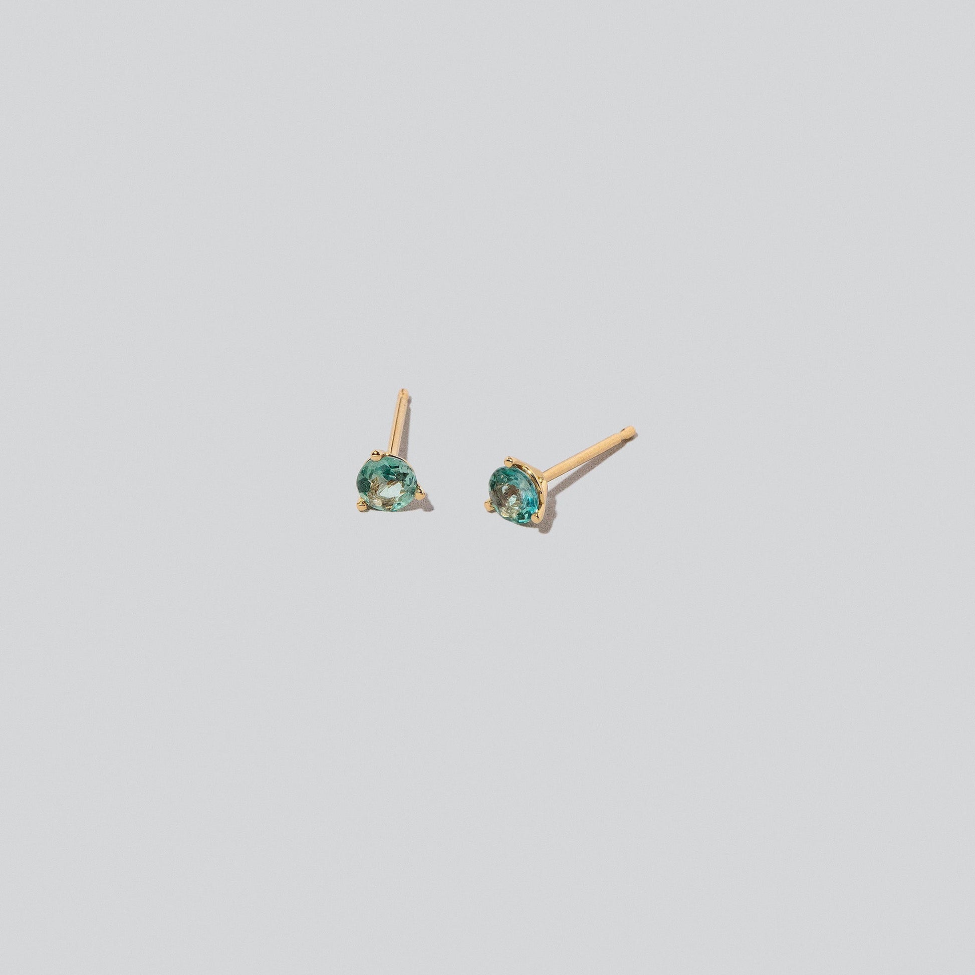 Martini Stud Earrings on light colored background.