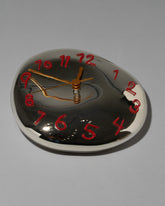 Red Two Glass Wall Clock on light color background.