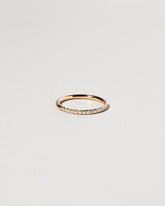 Gold White Diamond Sapphire Fifteen Stone Dot Band on light color background.