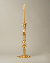 POLSPOTTEN Gold Large Drip Candle Holder on light color background.