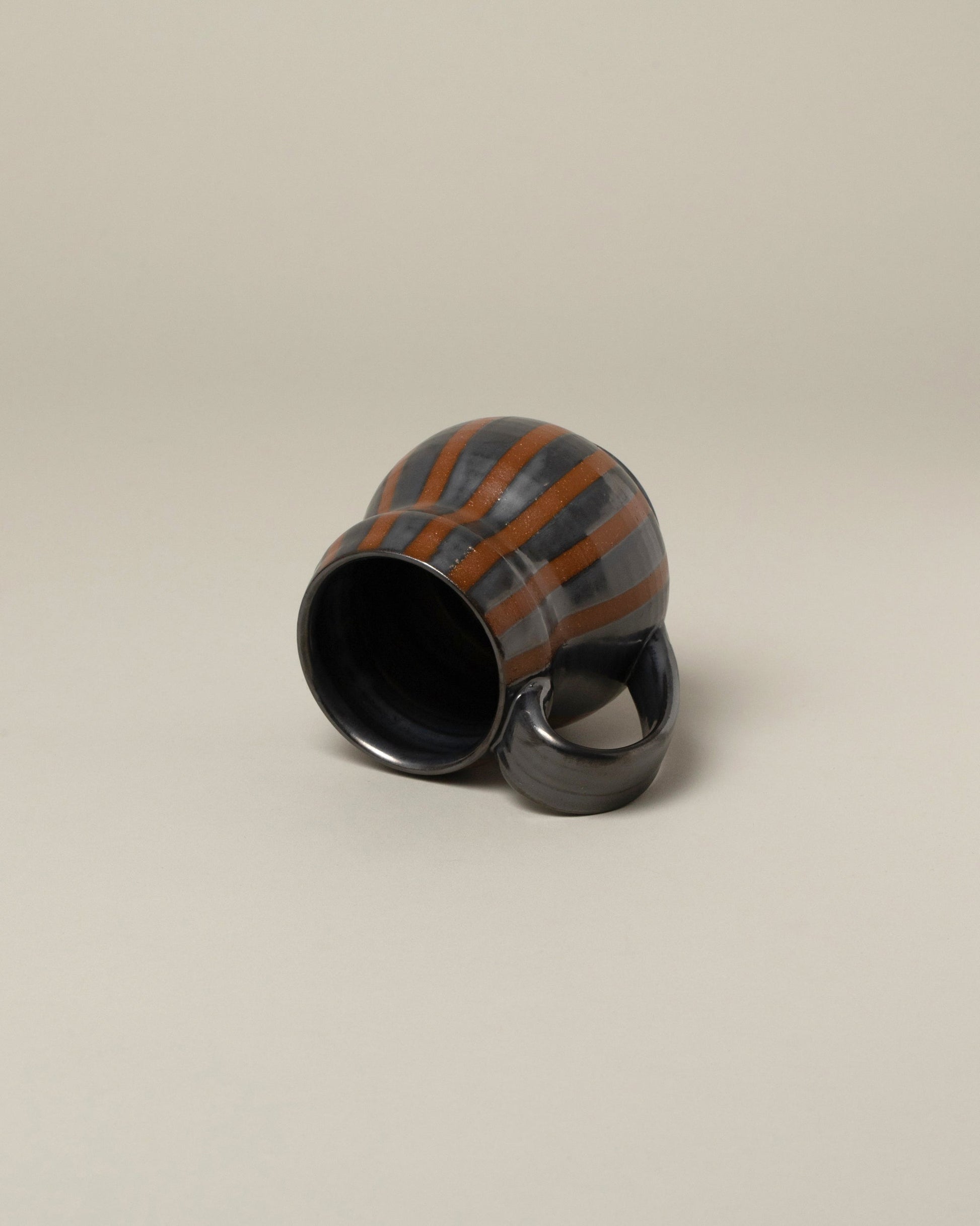 Inside view of the Jeremy Ayers Gunmetal Bubble Mug on light color background.