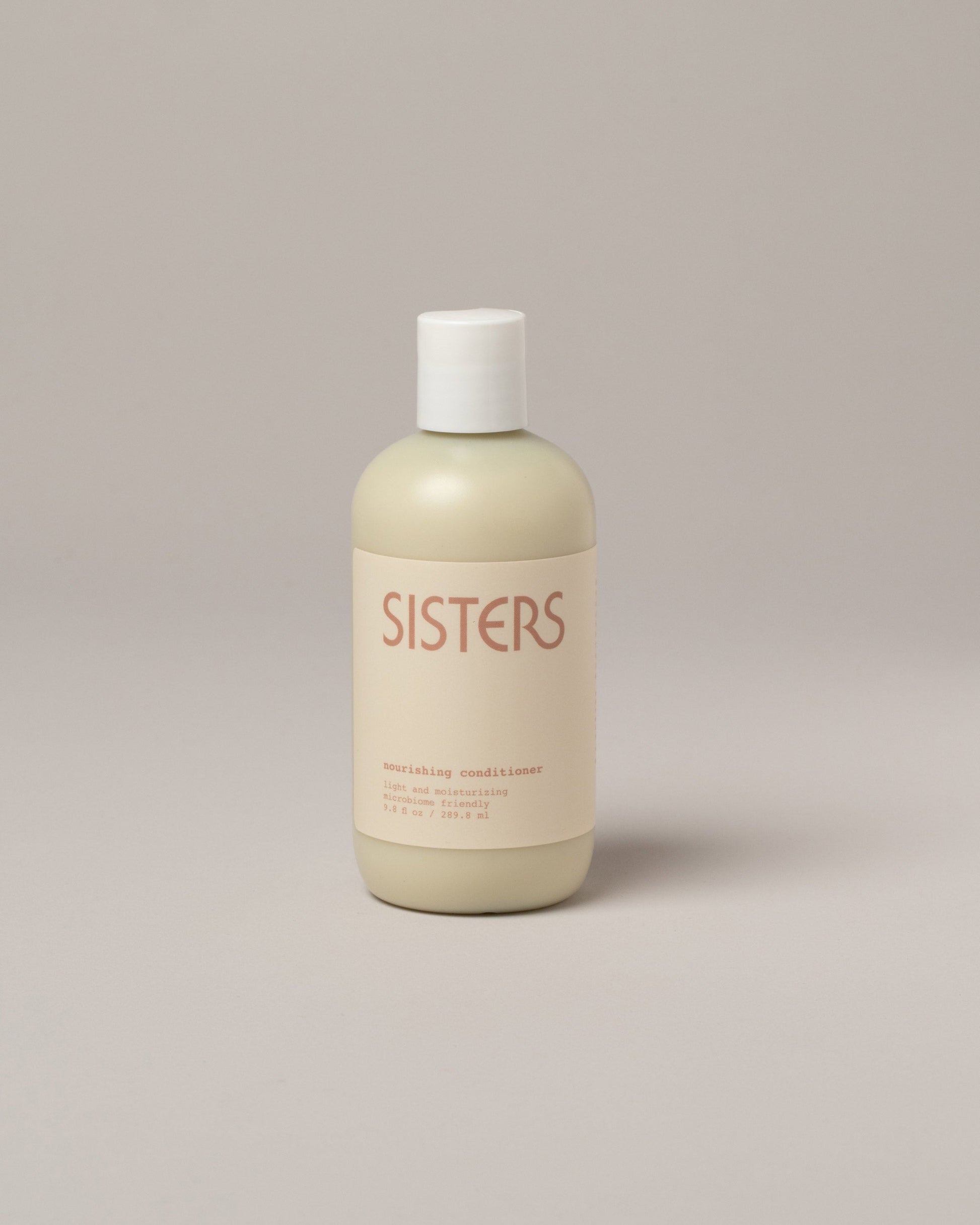  Sisters Body Nourishing Conditioner on light color background.