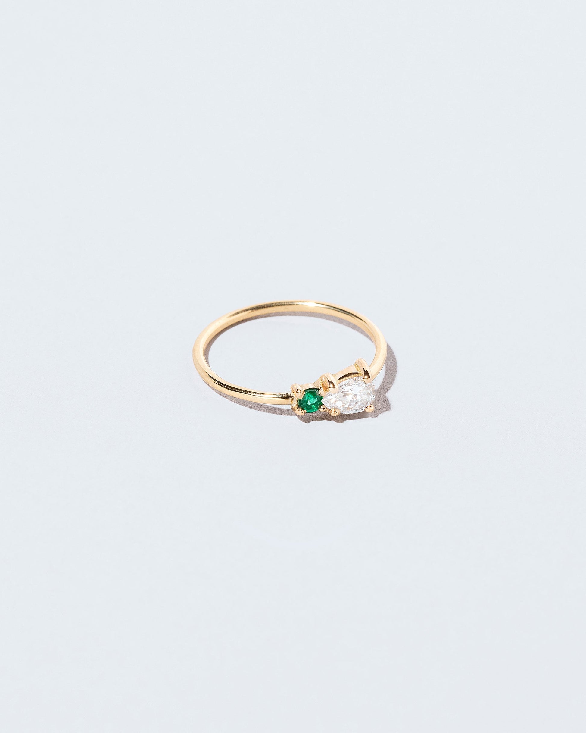  Teardrop Ring - Diamond & Emerald on light color background.
