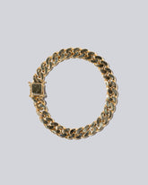 Curb Chain Bracelet on light colored background.