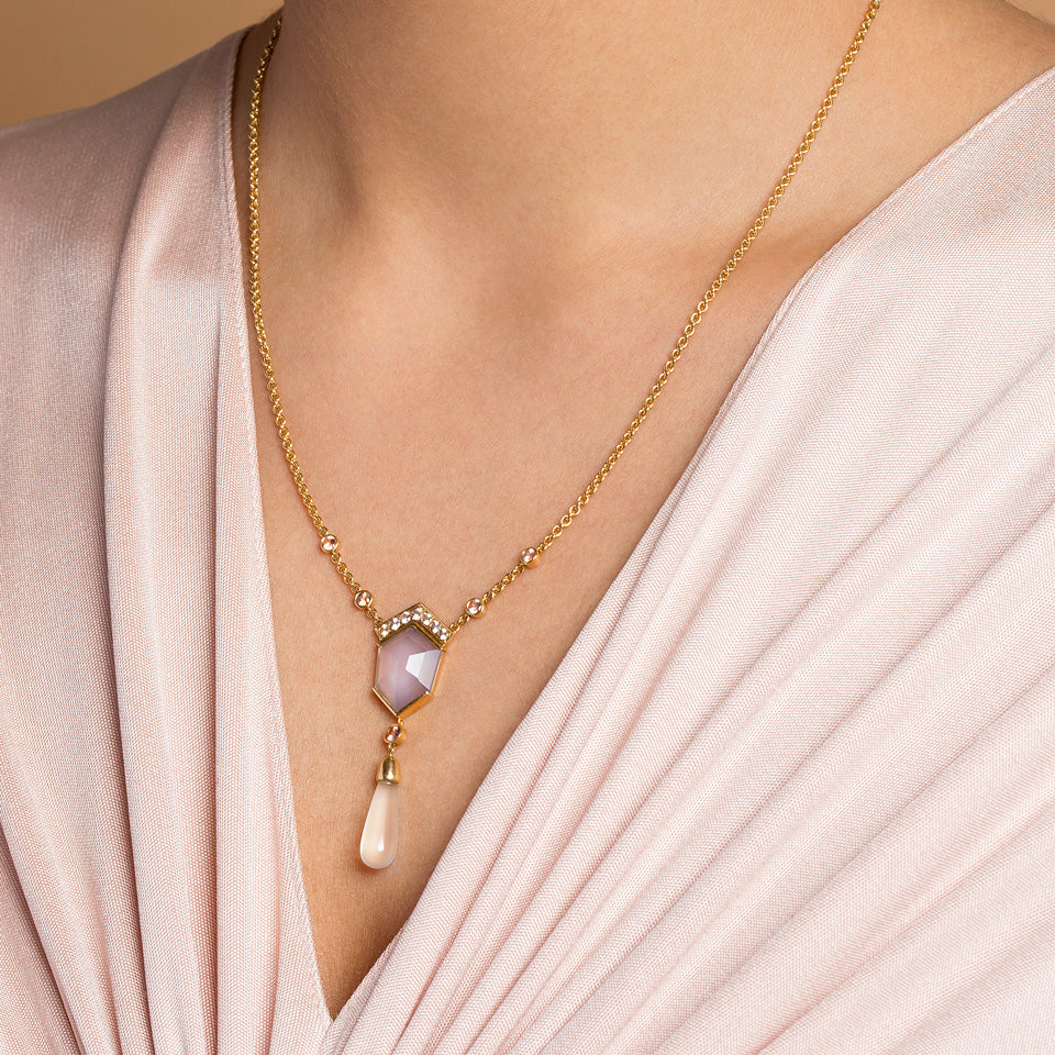 product_details::Blue Chalcedony Kite Necklace on model.
