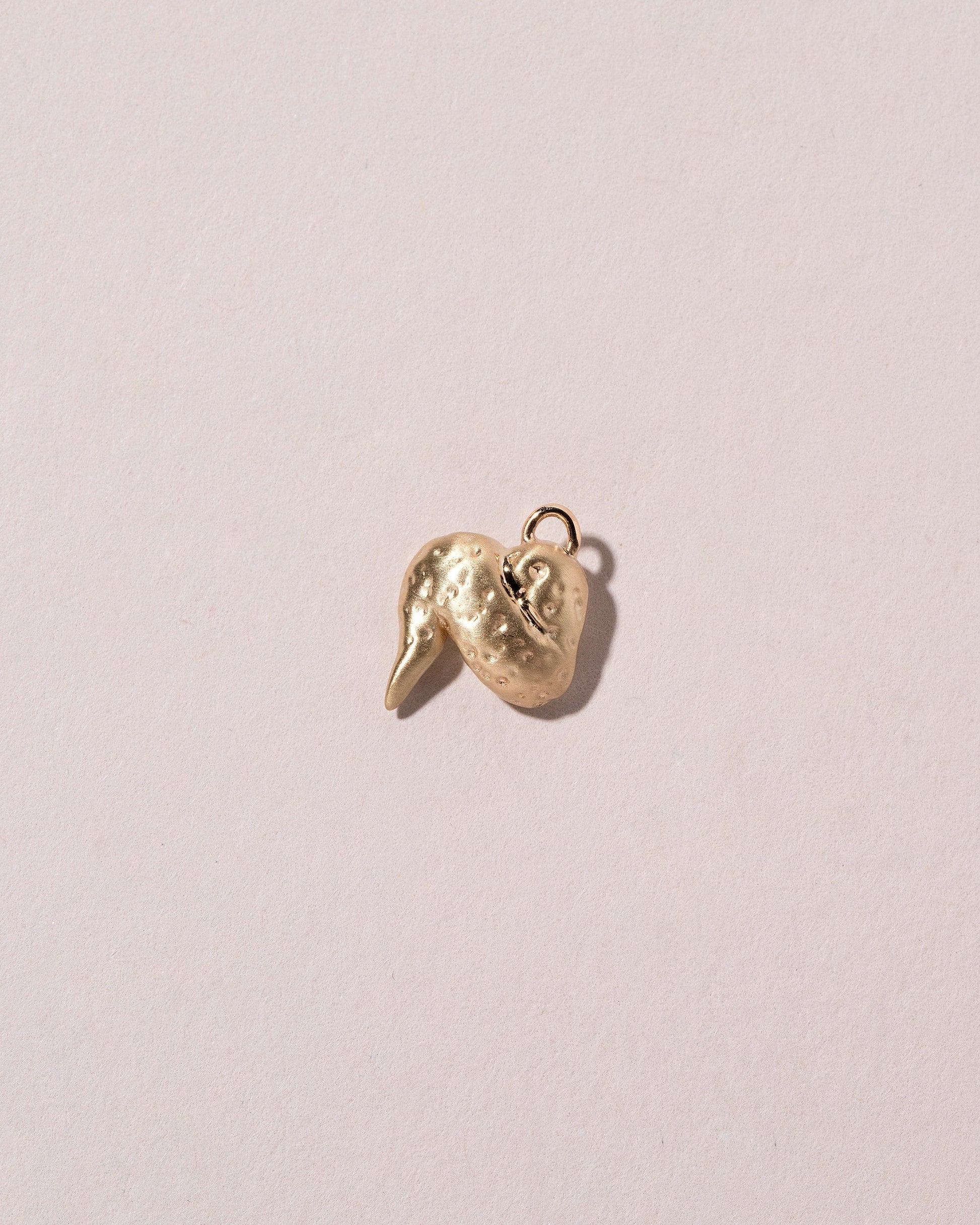  Chicken Wing Charm on light color background.