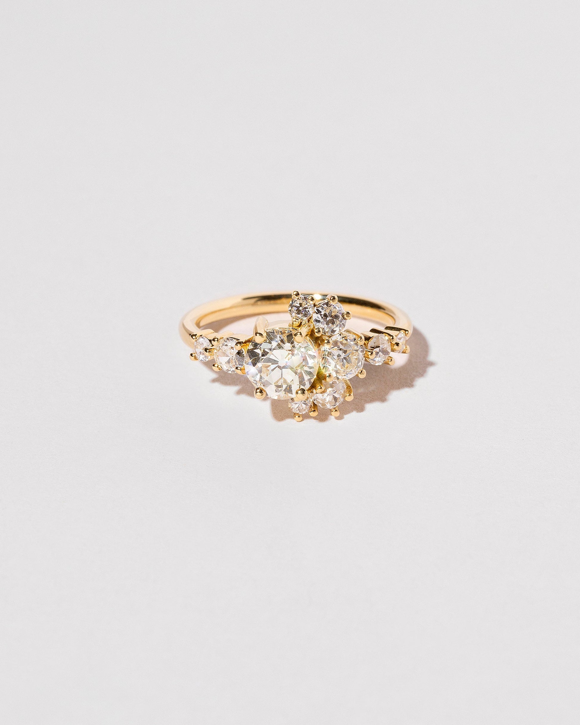  White Diamond Crescent Ring on light color background.