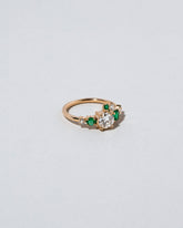  Luna Ring - White Diamond & Emerald on light color background.