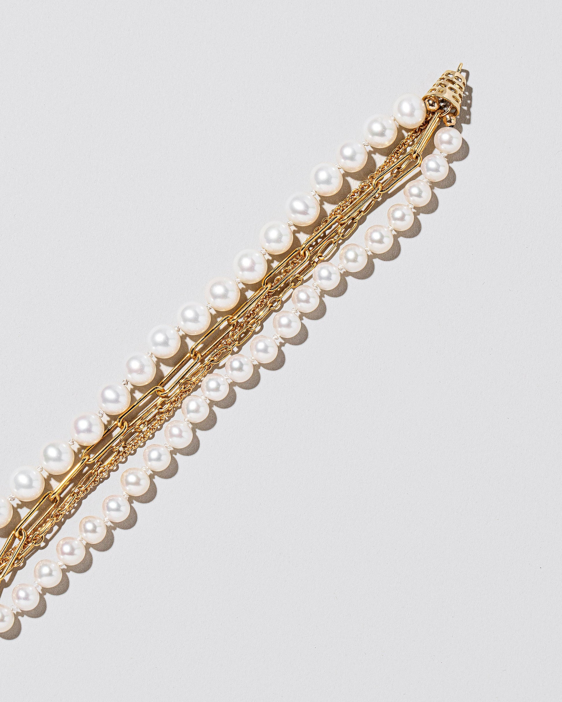  Layered Pearl Bracelet on light color background.