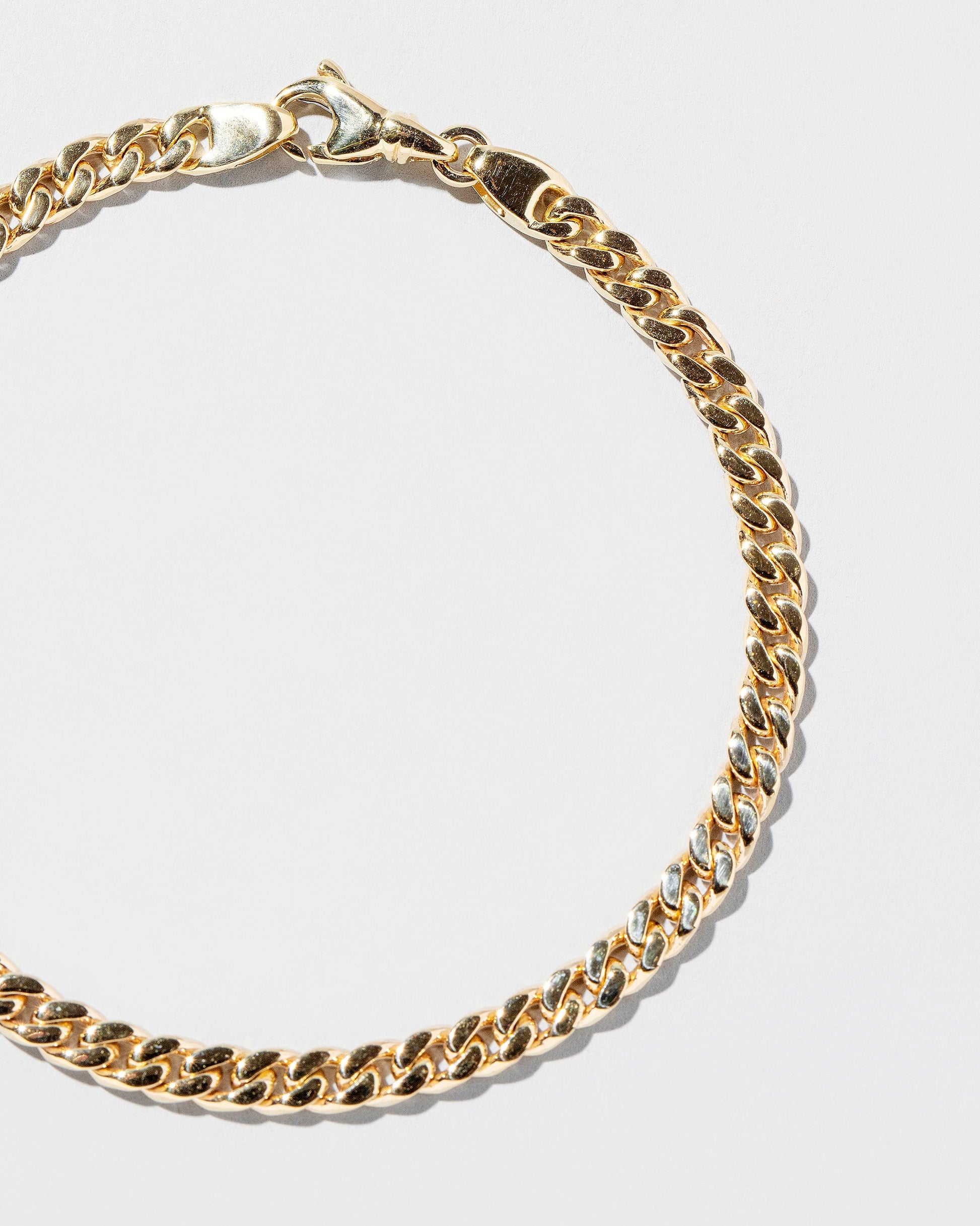  Curb Chain Bracelet on light color background.