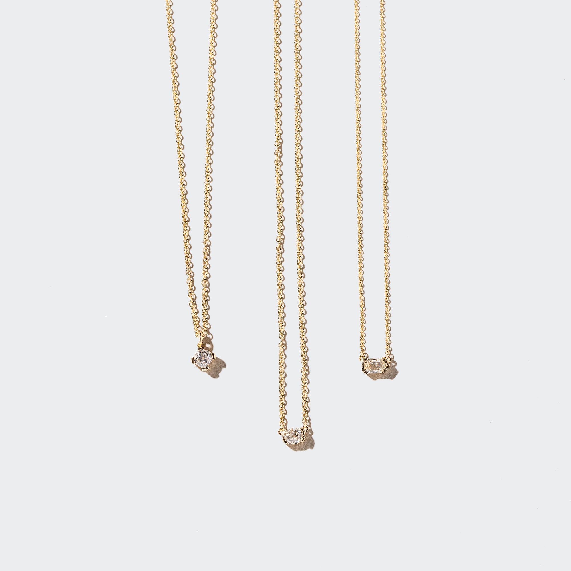 product_details:: Diamond Necklaces on light color background.