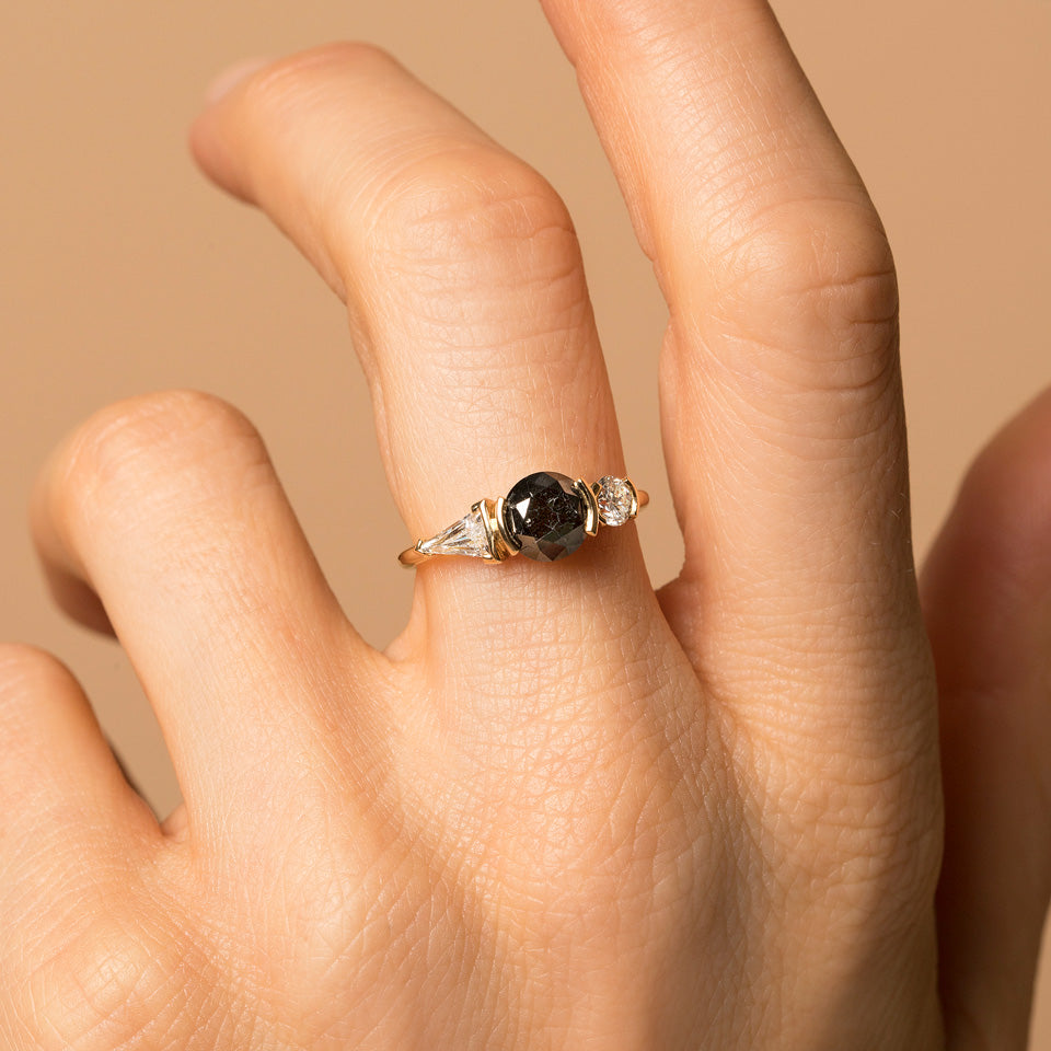 product_details::Black and White Diamond Ring on model.