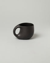 Dust and Form Large Charcoal Comfort Mug on light color background.
