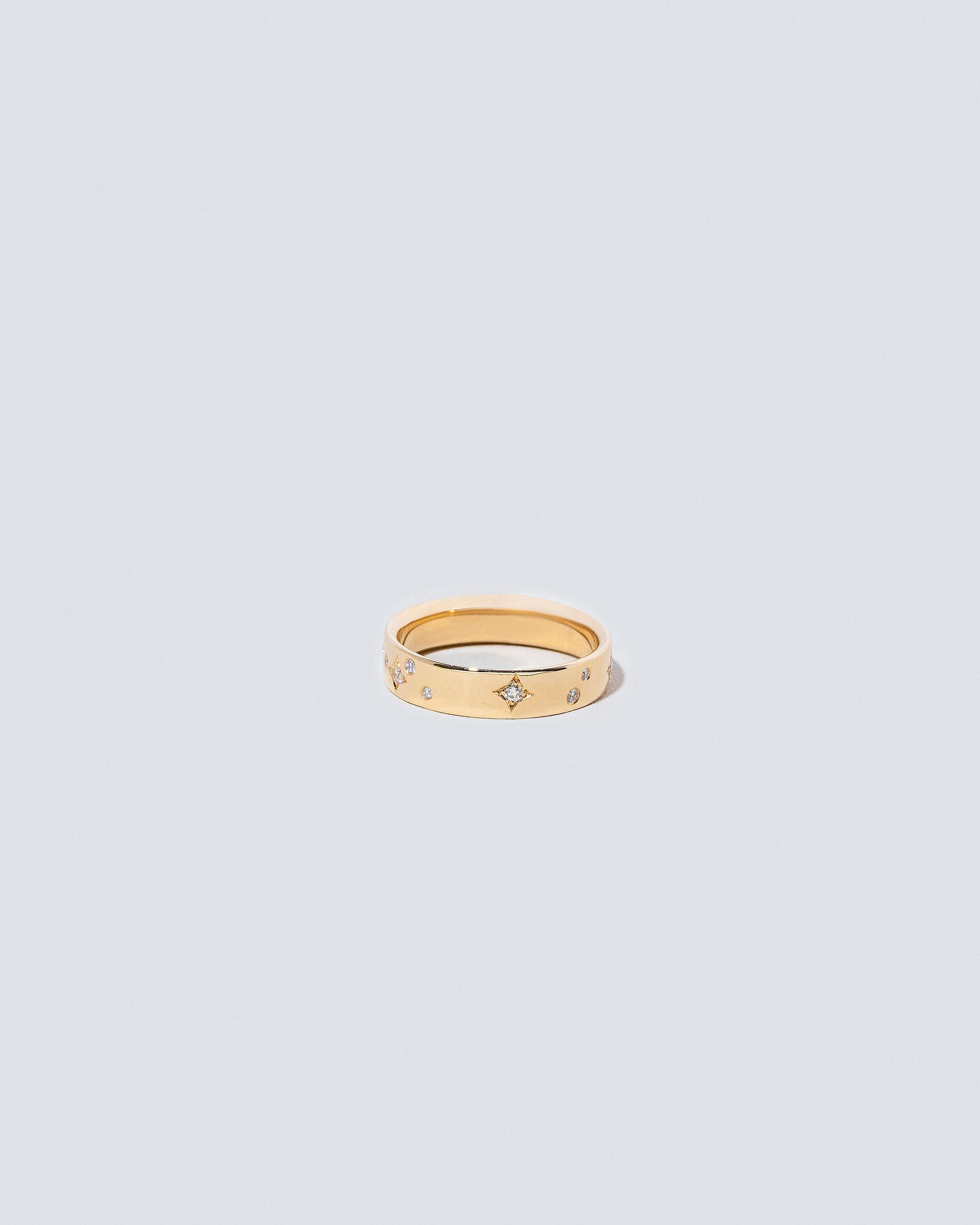 Gold 4mm Square Wire Band with Little Array White Diamonds added on light color background.
