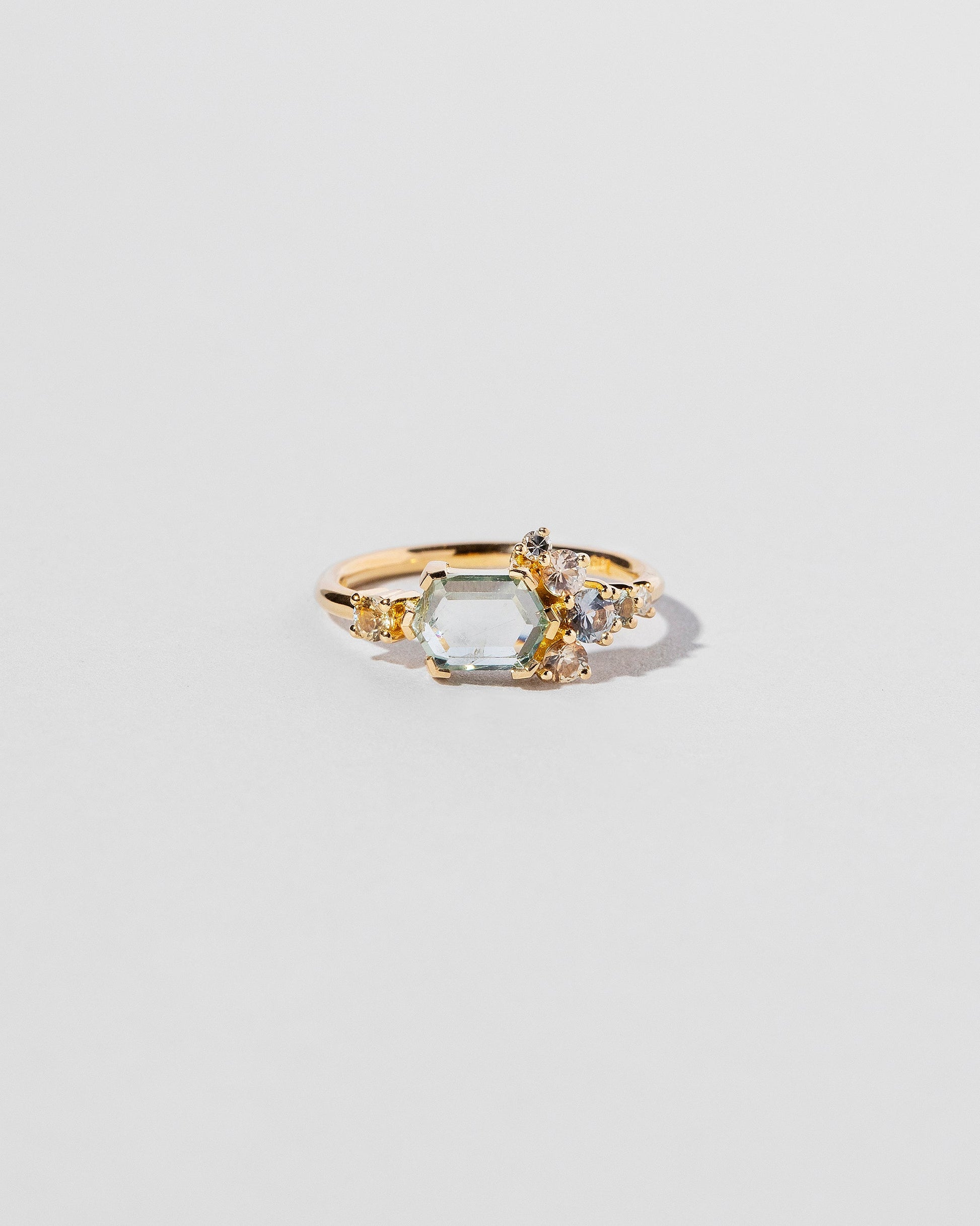  Hexagonal Slice Sapphire Cluster Ring on light color background.