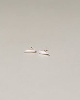 Wing Pearl Stud Earrings on light color background.