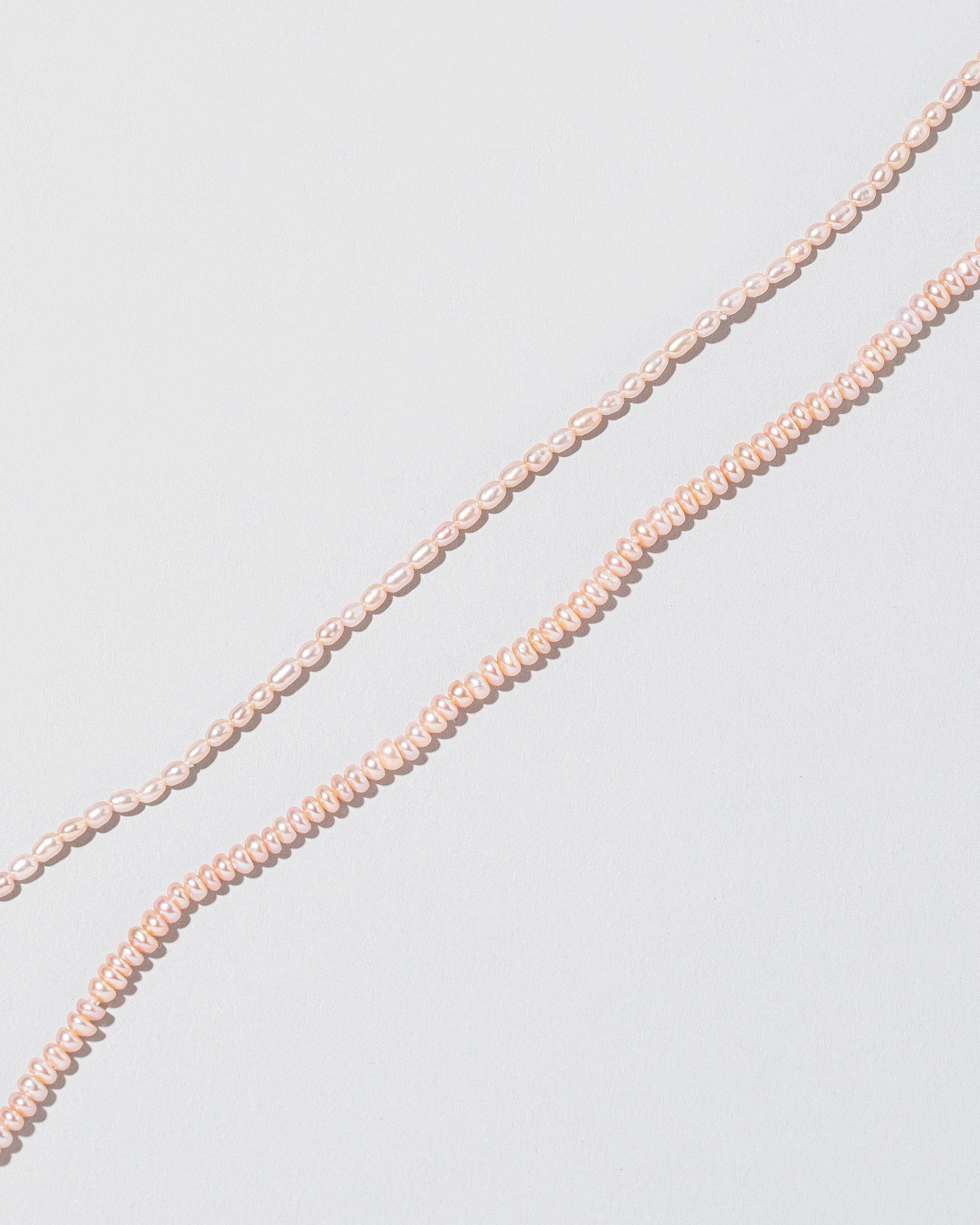  Seed Pearl Choker on light color background.