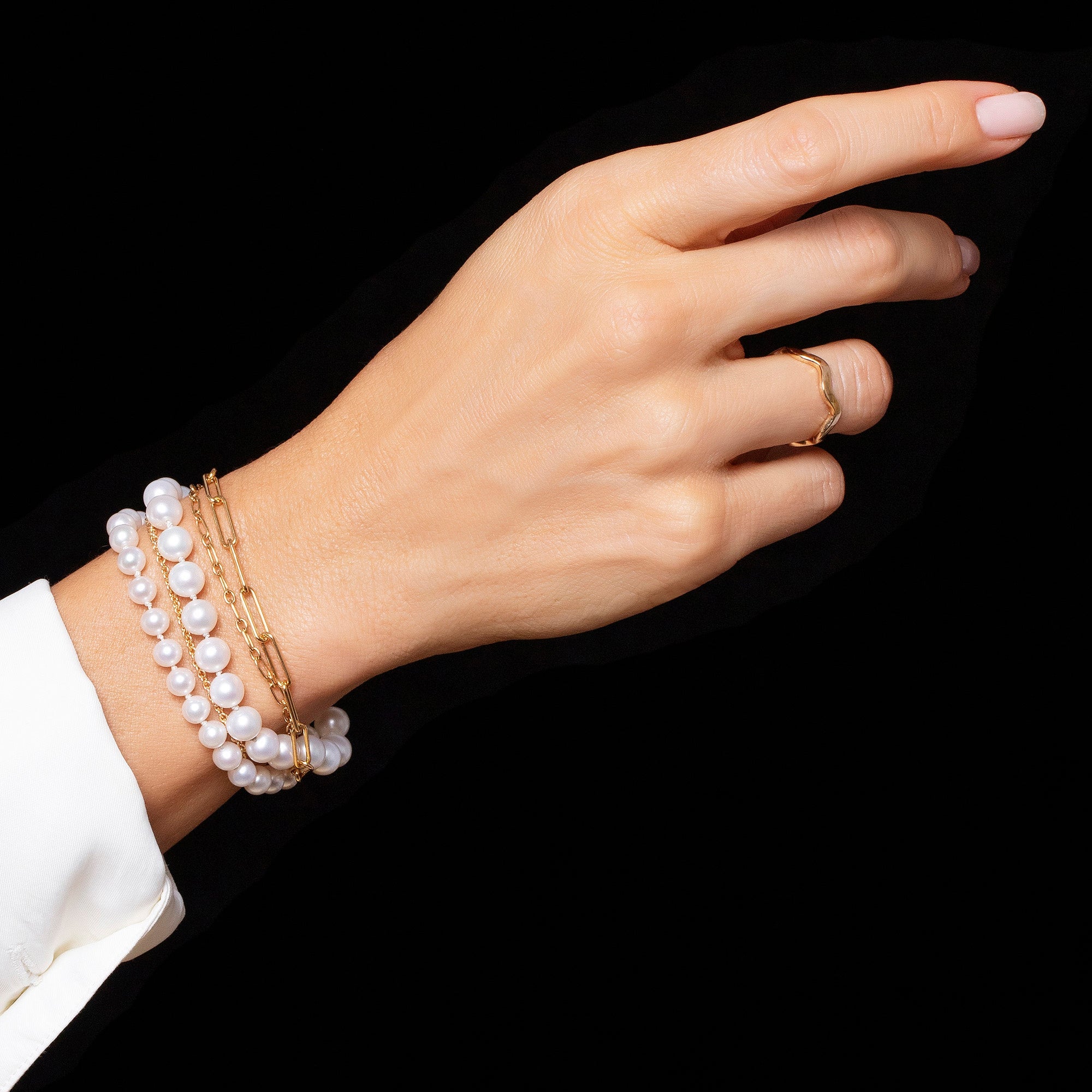 product_details::Layered Pearl Bracelet on model.