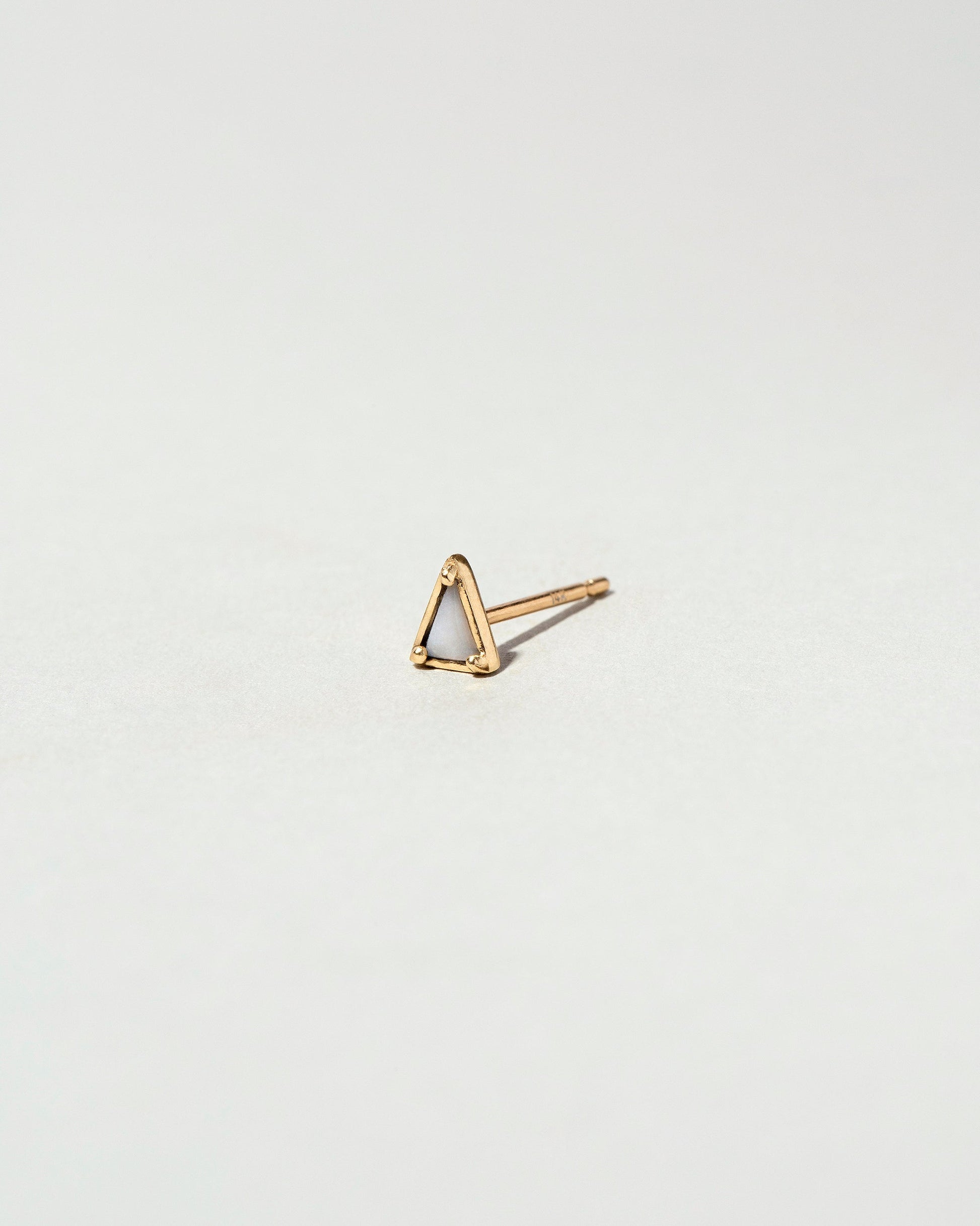  Triangle Single Stud on light color background.