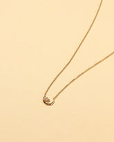  Moon Ray Necklace on light color background.