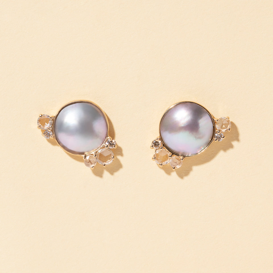 product_details::Mabe Pearl Cluster Earrings on light color background.